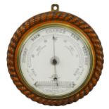 A circular oak barometer