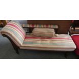 A chaise longue in modern striped fabric with bolster