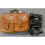 A Minotta camera, a leather attaché case and cased Prinzlux 10x50 binoculars (3)