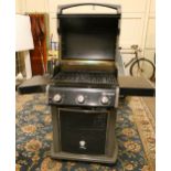 A Webber Spirit 3 gas BBQ with cover, also with a Christmas tree stand and 4 tubular metal deck