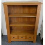 An oak open bookcase with two drawers and three cupboards to base, 100cm wide 135cm tall.