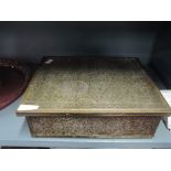 A brass sewing box with pressed foliate design work and contents