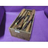 A selection of cabinet makers and wood turners chisels some with fruitwood handles