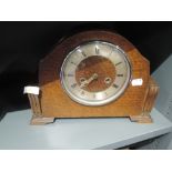 An oak bodied mantle clock with chime