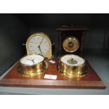 A selection of barometers clock and timer