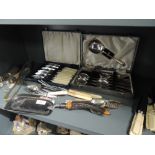 A selection of cutlery and table wares including boxed and HM silver