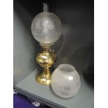 A brass bodied gas lamp with etched glass shades