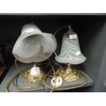 Two desk top or bedside lamps with regency design and colour glass shades