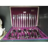 A canteen of table cutlery by Oneida silversmiths with floral detailing to handles