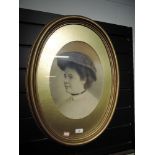 An Edwardian portrait in gilt oval frame