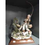 A figurine of a fisherman Ill Pestacore the Angler by Porcellane Principe