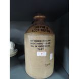 A stoneware advertising flagon for Stainton Bolton and Accrington 1949