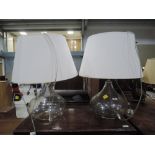 A pair of modern table lamps having blown glass bases