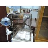 A vintage parrot or birdcage with brass tyle top