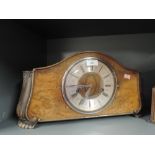 A mantle clock with burr veneer front and chime