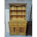 A vintage pine dresser (labelled Ercol)