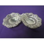 A pair of Victorian silver trinket dishes having pierced decoration and shaped rim with hoof
