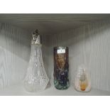 Two pieces of glass work. A claret jug with figural head decoration and colour art glass vase by