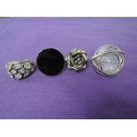 Four oversized dress rings of stylised form including 3D rose, moonstone etc (3 stamped 925)