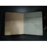 An early 20th century autograph book bearing signatures and original sketches and paintings