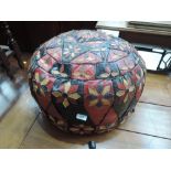 A vintage leather stitched bohemian design pouffe or bean bag