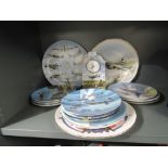 A selection of aviation and military display plates and ceramic mantle clock