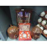 Two large stove kettles with brown enamel finish, Chinese tea set and jewellery cabinet