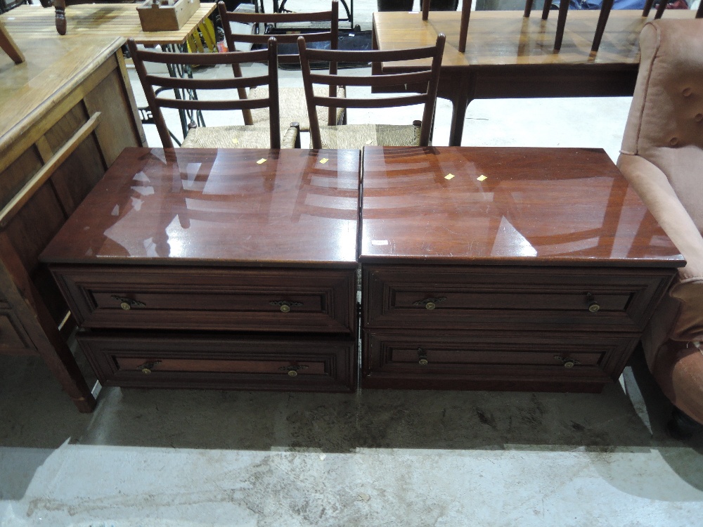 A pair of modern dark stained bedroom chests