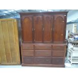 A reproduction hardwood housekeepers cupboards