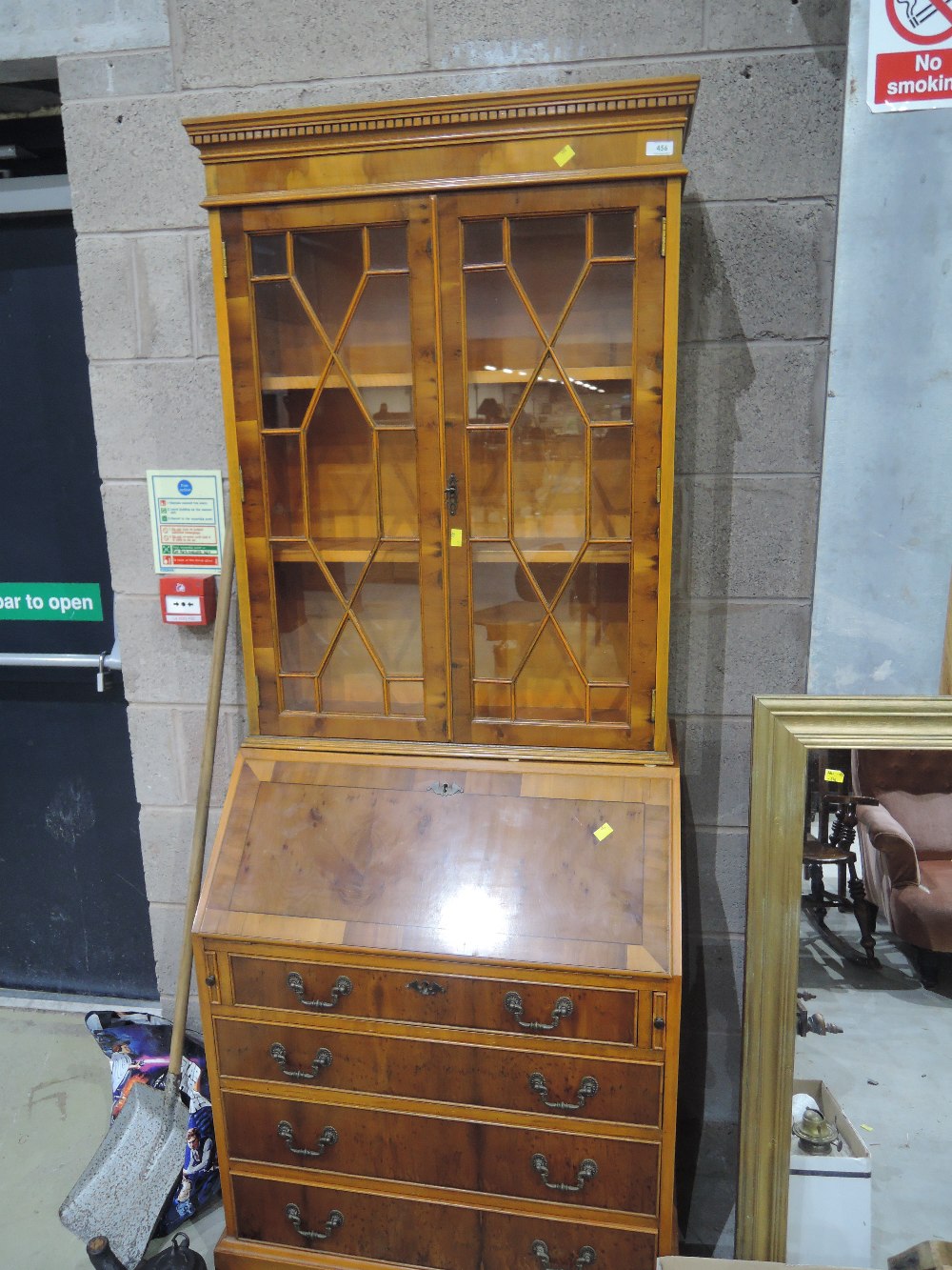 A reproduction yew wood bureau bookcase