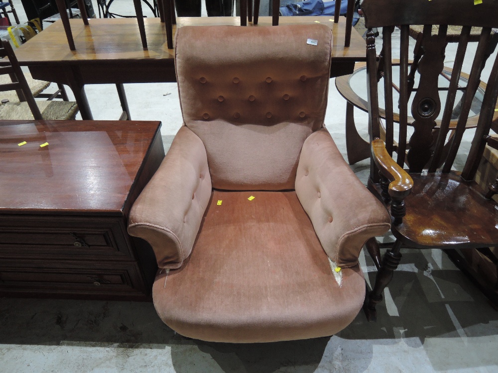 A Late Victorian upholstered low seat armchair