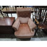 A Late Victorian upholstered low seat armchair