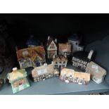 A selection of miniature model houses including Heritage houses and Staffordshire flat back censor