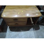 An Ercol coffee table with drawers