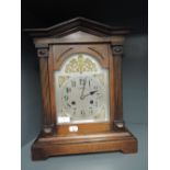 A gothic design mantle clock by H Samuel Manchester made in Wurtenburg with oak casing and chime