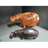 Two hand carved heavy wood Hippos