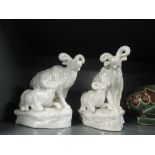 A pair of ram and sheep figures with lustre glaze
