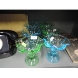 A selection of green and blue moulded glass ice cream sundae dishes