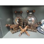 A selection of treen wood items including cannon book ends and teddy bear mirrors