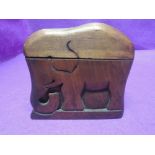A cigarette case from carved ethnic wood in the design of an Elephant