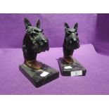 A pair of art deco design book ends cast metal and modelled as Scottie dog with marble base