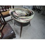 An atomic style coffee or side table with milky way swirl design top