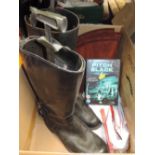 A pair of leather boots and some corner shelves