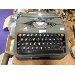 A portable typewriter by Empire the Aristocrat model