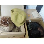Six vintage 1950s and 60s hats in two lovely boxes, some damage to a few of the feathered ones.