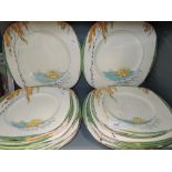 a set of cake and dinner plates by Burleigh ware in the Lily Pond design with beehive stamp