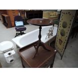 A reproduction mahogany wine table