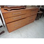 A vintage teak sideboard having 8 (2x4) drawers