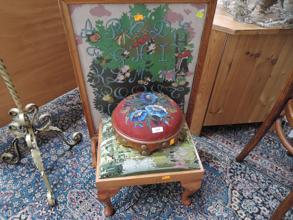 A Victorian beadwork footstool , a tapestry footstool and an oak firescreen