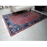 A vintage burgundy carpet square